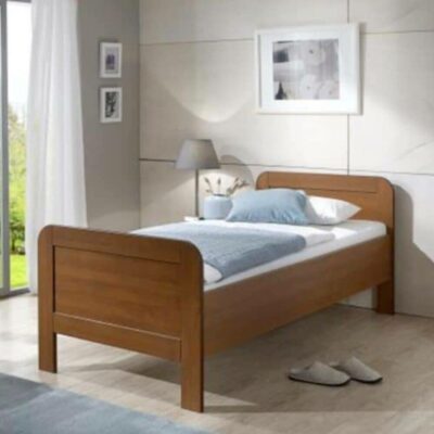 Seniorenbed Emma Kersen 90x200 in een slaapkamer